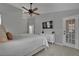 Bright bedroom features a ceiling fan, soft carpet, and access to a door at 4617 Mancilla St, Las Vegas, NV 89130