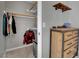 Bedroom closet with clothes rack and built-in shelves next to dresser at 4617 Mancilla St, Las Vegas, NV 89130