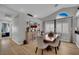 Elegant dining area with vaulted ceilings, wood floors, modern decor and a buffet at 4617 Mancilla St, Las Vegas, NV 89130