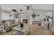 Well lit Living room featuring vaulted ceilings and a cozy fireplace at 4617 Mancilla St, Las Vegas, NV 89130