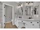 Bright main bath features dual sinks, quartz counters and a private commode at 4617 Mancilla St, Las Vegas, NV 89130