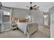 Spacious main bedroom features a ceiling fan, soft carpet, and ensuite bathroom access at 4617 Mancilla St, Las Vegas, NV 89130