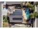Stunning aerial view of home with solar panels and a refreshing backyard pool at 4937 Semifonte Dr, Pahrump, NV 89061