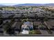 Aerial view of a neighborhood featuring mature landscaping, multiple homes, and mountain views at 4937 Semifonte Dr, Pahrump, NV 89061