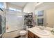 Bright bathroom featuring a shower over tub combination and a vanity sink with mirror at 4937 Semifonte Dr, Pahrump, NV 89061