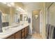 Double sink bathroom with ample lighting, vanity, and a separate water closet at 4937 Semifonte Dr, Pahrump, NV 89061