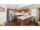 Well-lit kitchen with stainless steel appliances, white countertops, and ample cabinet space for storage and functionality at 4937 Semifonte Dr, Pahrump, NV 89061