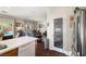 Bright, open kitchen featuring white countertops, stainless steel appliances, and seamless flow to the living area at 4937 Semifonte Dr, Pahrump, NV 89061