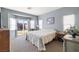 Spacious primary bedroom with bay window, patio access, and neutral decor at 4937 Semifonte Dr, Pahrump, NV 89061