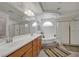 Bright bathroom with double sinks, separate soaking tub, and a glass-enclosed shower at 5080 Plymouth Bay Ct, Las Vegas, NV 89141