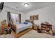 Functional bedroom with neutral walls, simple bed, and space-saving storage solutions at 5080 Plymouth Bay Ct, Las Vegas, NV 89141