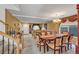 Formal dining room featuring an elegant chandelier, a large table and neutral colored walls at 5080 Plymouth Bay Ct, Las Vegas, NV 89141