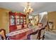 Formal dining room featuring a large china cabinet, an elegant table and neutral-colored walls at 5080 Plymouth Bay Ct, Las Vegas, NV 89141