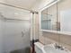Bright bathroom with tile flooring, a glass door shower, and a modern sink and mirror at 5159 N Monte Cristo Way, Las Vegas, NV 89149