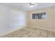 The room features tile floors, bright lighting, and a window that provides natural light at 5159 N Monte Cristo Way, Las Vegas, NV 89149