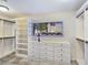 Bright closet with built in shelving, drawers and racks by a window providing natural light at 5159 N Monte Cristo Way, Las Vegas, NV 89149