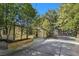 Charming home with mature landscaping along the driveway, creating a serene atmosphere at 5159 N Monte Cristo Way, Las Vegas, NV 89149