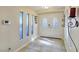 Bright entryway with tiled floors, decorative windows, and an ornate double door at 5159 N Monte Cristo Way, Las Vegas, NV 89149