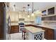 Charming kitchen featuring granite counters, stainless steel appliances, and custom cabinets at 5159 N Monte Cristo Way, Las Vegas, NV 89149
