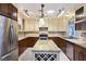 Well-appointed kitchen featuring stainless steel appliances, custom cabinetry, and granite countertops at 5159 N Monte Cristo Way, Las Vegas, NV 89149