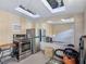 A small kitchenette features stainless steel appliances, skylights, and ample storage space at 5159 N Monte Cristo Way, Las Vegas, NV 89149
