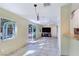 Bright living room featuring tile floors, large windows, and access to the outdoor patio at 5159 N Monte Cristo Way, Las Vegas, NV 89149