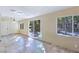 Spacious living room with ample natural light and access to a serene outdoor space at 5159 N Monte Cristo Way, Las Vegas, NV 89149