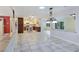 The open layout features tile floors seamlessly connecting the dining area, kitchen, and living spaces at 5159 N Monte Cristo Way, Las Vegas, NV 89149