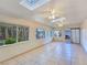 Sunroom with tile floors, natural lighting from skylights and windows looking out into the landscape at 5159 N Monte Cristo Way, Las Vegas, NV 89149
