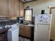Compact kitchen layout with essential appliances, ideal for a cozy living space at 542 Bonelli Ave, Overton, NV 89040