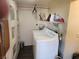 Functional laundry area with washer and overhead shelving at 542 Bonelli Ave, Overton, NV 89040