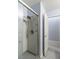 Walk-in shower with a grab bar is easily accessible from the bathroom doorway with wood-style floors at 5441 Rose Hills St, Las Vegas, NV 89149
