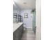 Bathroom features a long vanity with double sinks, and a glass enclosed walk-in shower at 5441 Rose Hills St, Las Vegas, NV 89149
