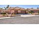 A charming single-story home featuring a three-car garage, desert landscaping, and a tile roof at 5441 Rose Hills St, Las Vegas, NV 89149