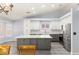 Modern kitchen featuring new cabinets, stainless steel appliances, and gray flooring at 5441 Rose Hills St, Las Vegas, NV 89149