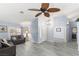 Open-concept living room featuring gray floors, neutral decor, and an airy, spacious feel at 5441 Rose Hills St, Las Vegas, NV 89149