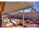 Staged patio with outdoor seating overlooking the landscaped backyard at 5441 Rose Hills St, Las Vegas, NV 89149