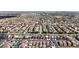 Extensive aerial view displaying a well-planned community of single-Gathering homes, roads, and green spaces at 5661 Brimstone Hill Ave, Las Vegas, NV 89141