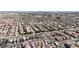 Wide aerial view of a neighborhood showing uniform single-Gathering homes, streets and some sparse landscaping at 5661 Brimstone Hill Ave, Las Vegas, NV 89141