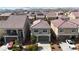 Aerial view of residences featuring tile roofs and well-kept landscaping at 5661 Brimstone Hill Ave, Las Vegas, NV 89141