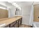 Bathroom featuring a vanity with dark cabinets, a bathtub/shower, and neutral walls at 5661 Brimstone Hill Ave, Las Vegas, NV 89141