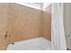 Shower and tub combination features a tan tiled backsplash at 5661 Brimstone Hill Ave, Las Vegas, NV 89141