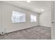 Bright bedroom with carpet flooring, white walls and trim, and natural light at 5661 Brimstone Hill Ave, Las Vegas, NV 89141