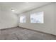 Bedroom featuring carpet flooring, white walls and trim, and natural light at 5661 Brimstone Hill Ave, Las Vegas, NV 89141