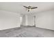 Upstairs hallway with two doorways, neutral paint and carpeted flooring at 5661 Brimstone Hill Ave, Las Vegas, NV 89141