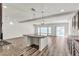 Open concept living room featuring hardwood floors, recessed lighting, and a sliding glass door at 5661 Brimstone Hill Ave, Las Vegas, NV 89141