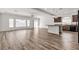 Spacious open-concept living room with modern wood floors and ample natural light at 5661 Brimstone Hill Ave, Las Vegas, NV 89141
