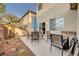 Outdoor patio area with a dining table and seating, perfect for enjoying outdoor meals and relaxing at 5854 Willow Trace Ave, Las Vegas, NV 89139