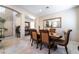 Inviting dining room with dark wood table, upholstered chairs and tile flooring at 5854 Willow Trace Ave, Las Vegas, NV 89139
