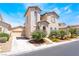 Inviting two-story home with desert landscaping and attached two car garage at 5854 Willow Trace Ave, Las Vegas, NV 89139
